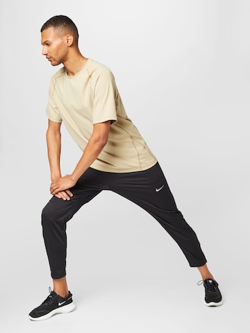 NIKE Tapered Sportbroek in Zwart