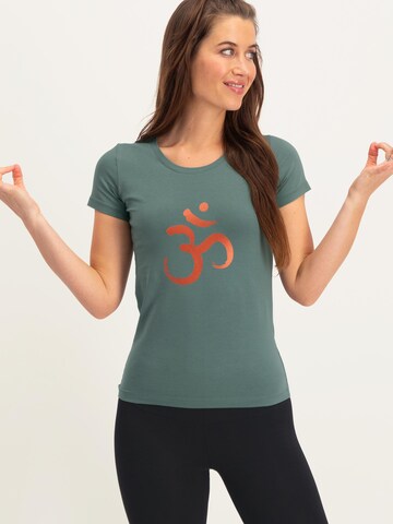 Urban Goddess Yoga & Activewear Sporttop 'Om Core Yoga and Pilates' in Grün