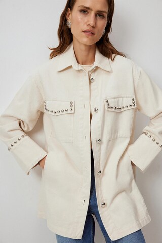 Touche Prive Tussenjas in Beige