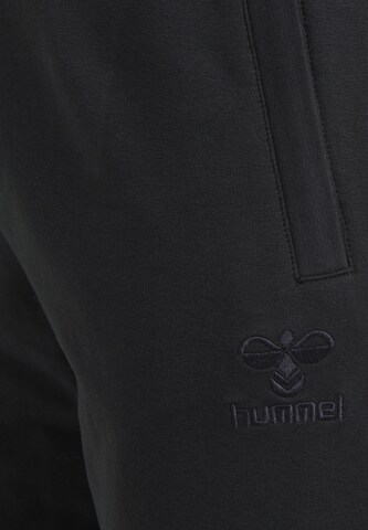 Hummel Zwężany krój Spodnie sportowe 'Move' w kolorze czarny