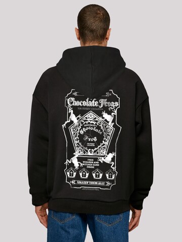 Sweat-shirt 'Harry Potter Chocolate Frogs' F4NT4STIC en noir : devant