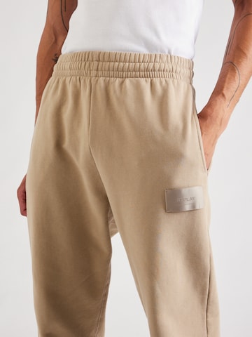 Tapered Pantaloni di REPLAY in beige