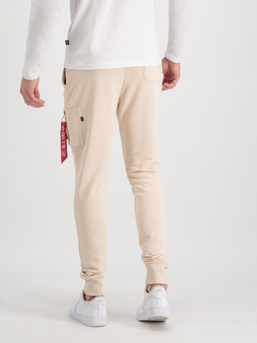 ALPHA INDUSTRIES Tapered Housut 'X-Fit' värissä beige