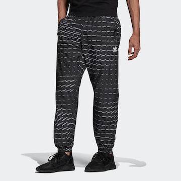 ADIDAS ORIGINALS Tapered Trousers in Black: front