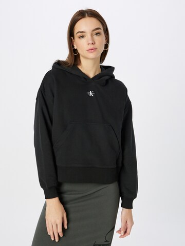 Sweat-shirt Calvin Klein Jeans en noir : devant