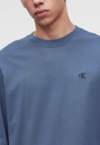 Tricou de la Calvin Klein Jeans pe albastru: față