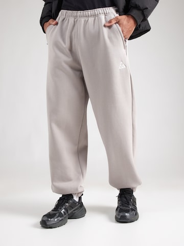 pilka Nike Sportswear Siaurėjantis Kelnės: priekis