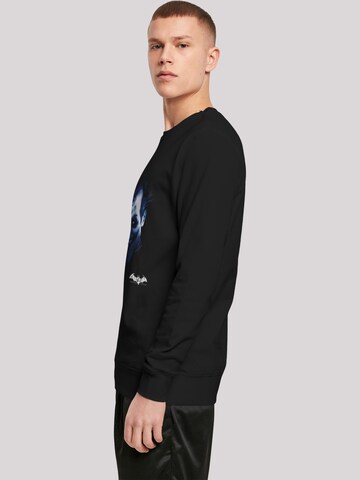 Sweat-shirt 'DC Comics Batman Arkham Asylum Joker Face Distress' F4NT4STIC en noir