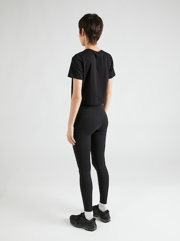 Skinny Pantalon de sport 'UNIVERSA' NIKE en noir