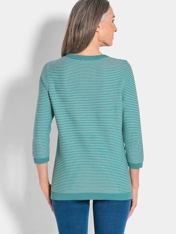 Goldner Pullover in Grün