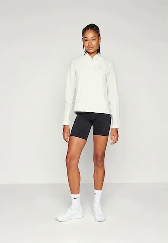Giacca sportiva 'SWIFT' di NIKE in beige