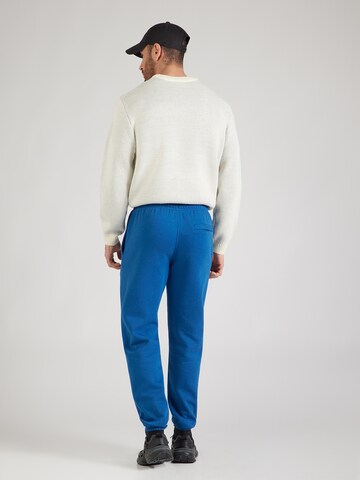 Nike Sportswear Tapered Broek 'CLUB' in Blauw