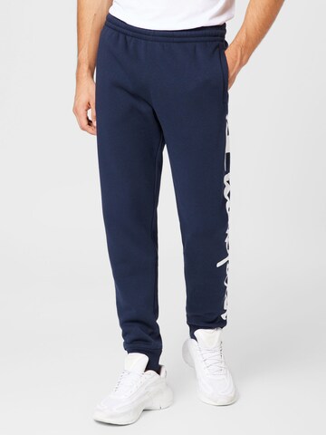 Effilé Pantalon Champion Authentic Athletic Apparel en bleu : devant