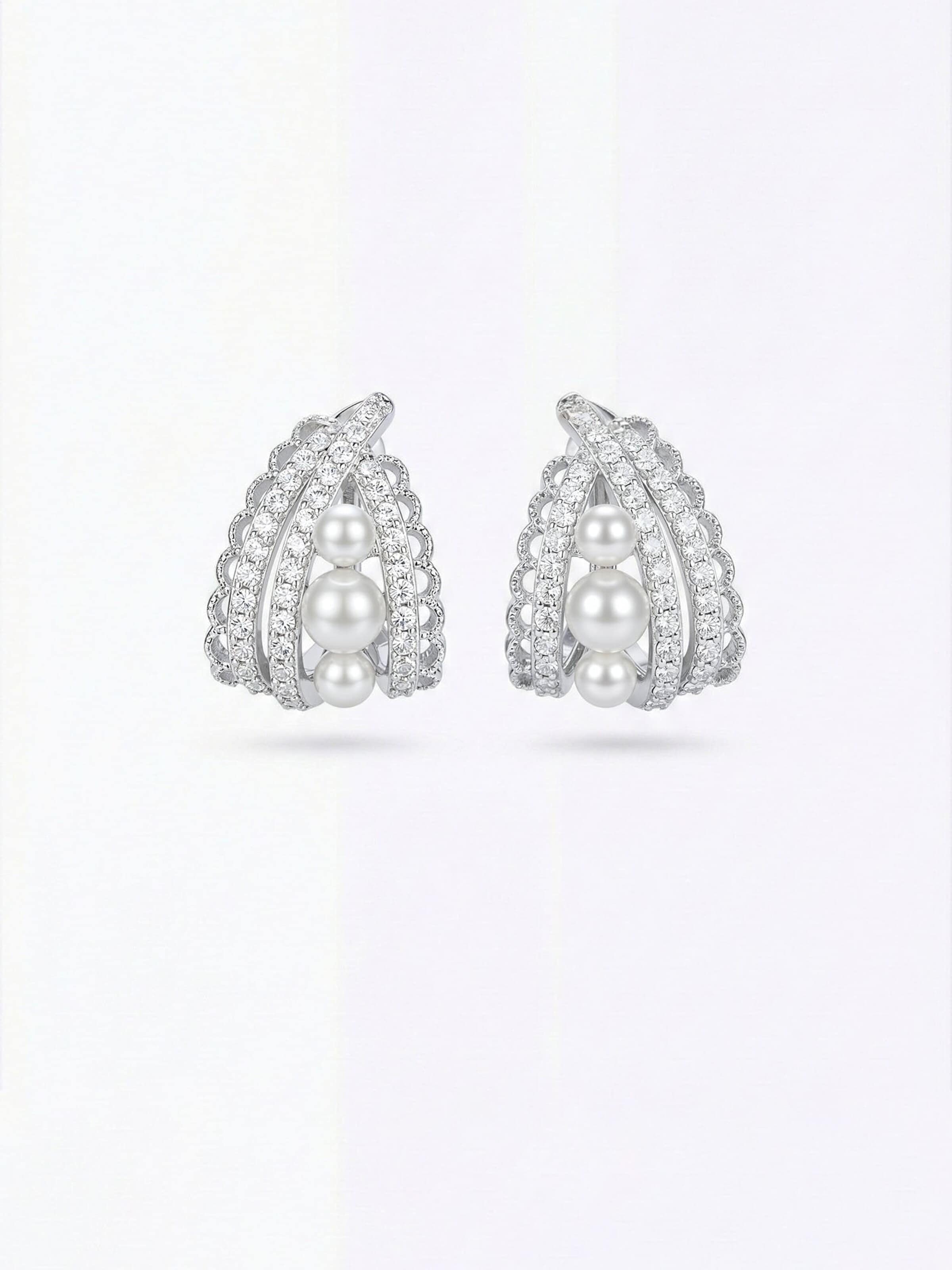Nemomatheo Earrings 'Crystal Nest Collection – Pearl Embrace' in Silver: front