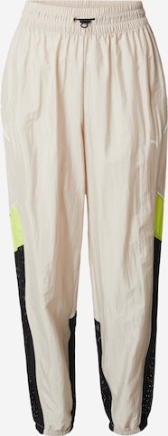 PUMA - Tapered Pantalón deportivo 'MOVE' en beige: frente