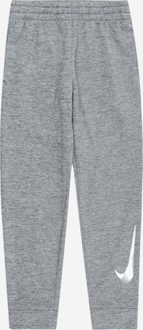 NIKETapered Sportske hlače - siva boja: prednji dio