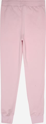 Tapered Pantaloni sport de la UNDER ARMOUR pe roz