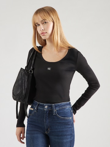 T-shirt Calvin Klein Jeans en noir : devant