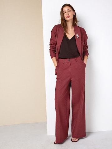 Wide leg Pantaloni con piega frontale di Next in marrone