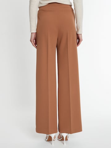 Ana Alcazar Loose fit Trousers with creases in Brown