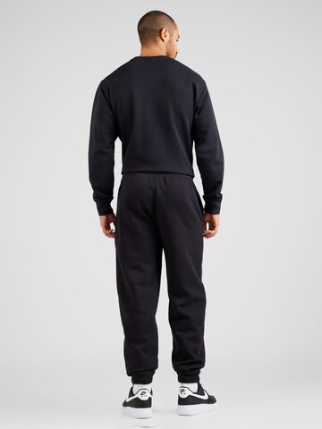 Champion Authentic Athletic Apparel Tapered Trousers in Black