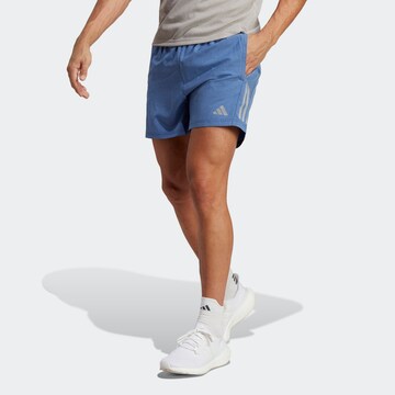 regular Pantaloni sportivi 'Own The Run' di ADIDAS PERFORMANCE in blu: frontale