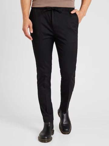 TOPMAN Regular Pants in Black: front