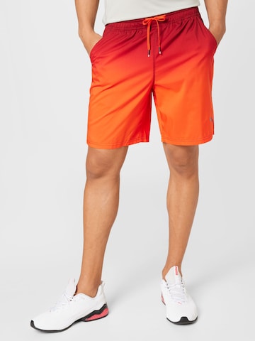 Regular Pantalon de sport PUMA en orange : devant