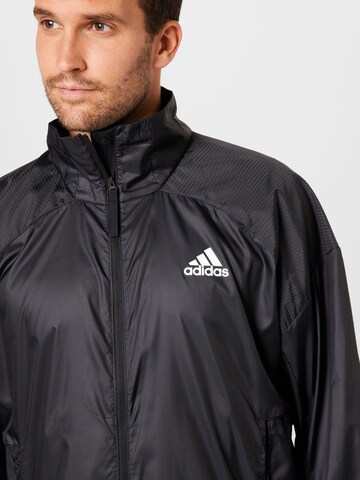 ADIDAS SPORTSWEAR Športna jakna 'TRAVEER' | črna barva