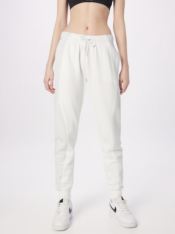 Nike Sportswear Tapered Trousers in White: front