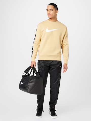 Nike Sportswear Дънки Tapered Leg Панталон в черно