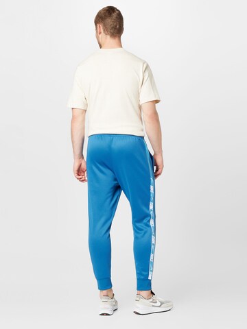 Nike Sportswear Tapered Pants in Blue