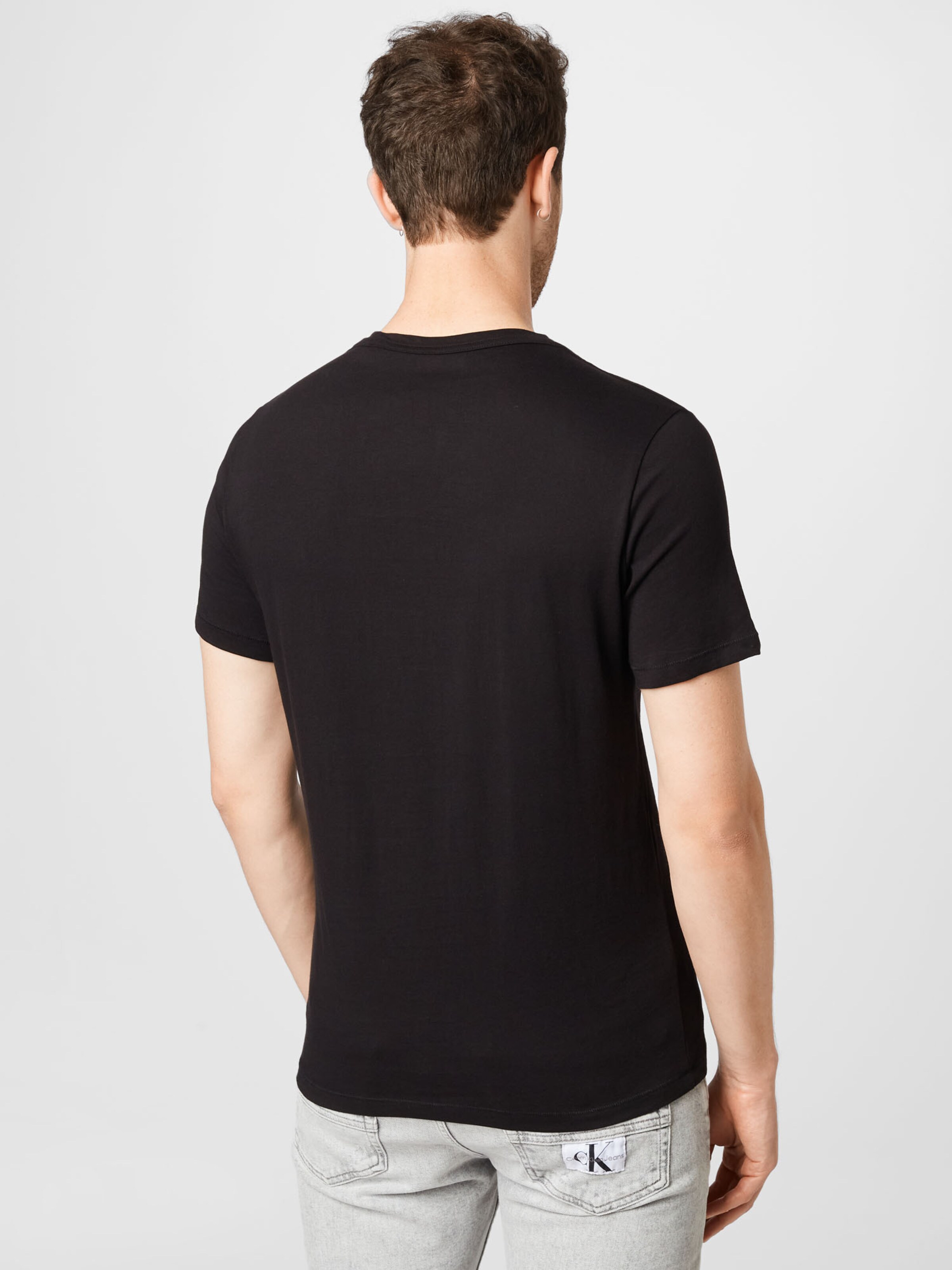 Männer Shirts GUESS T-Shirt 'SKULLY' in Schwarz - FI36284
