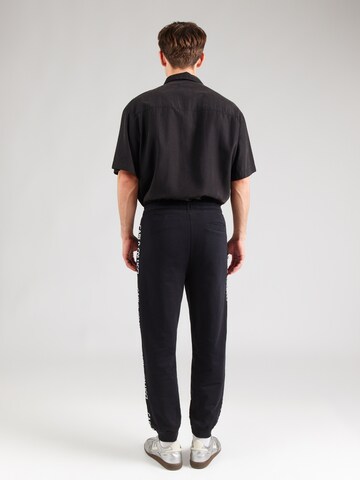 Carlo Colucci Tapered Παντελόνι σε μαύρο: πίσω