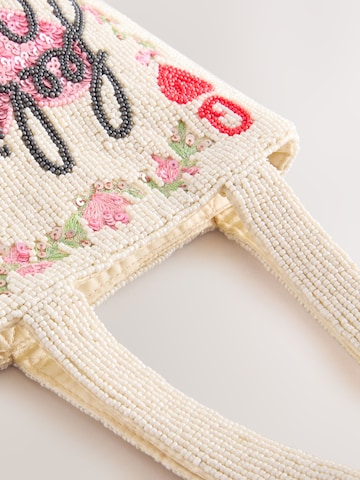 Next Ostoskassi värissä valkoinen