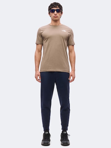 THE NORTH FACE Tapered Urheiluhousut värissä sininen