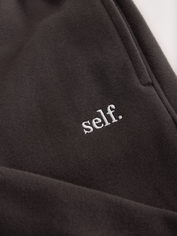 self. Wide Leg Jogginghose in Braun