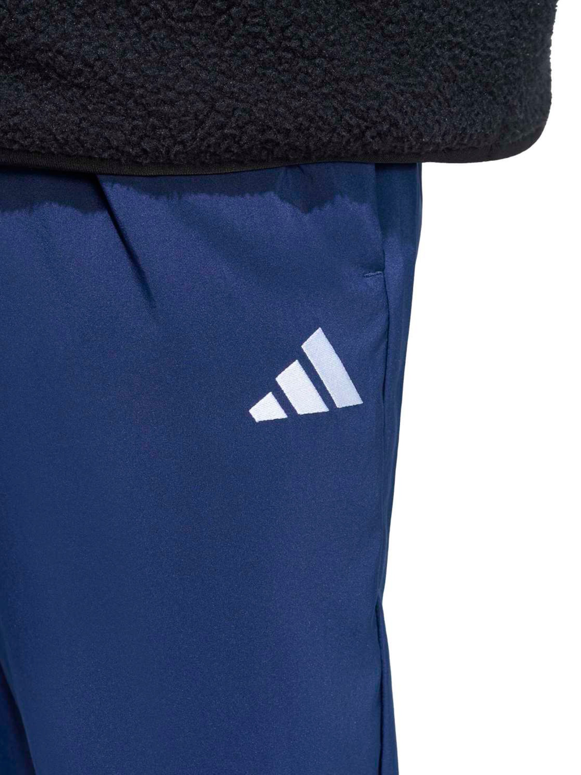 ADIDAS SPORTSWEAR Loosefit Sportovní kalhoty 'Essentials Small Logo Stanford Lite Woven Tapered Open Hem' – modrá