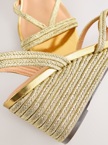 Next - Sandalias en oro