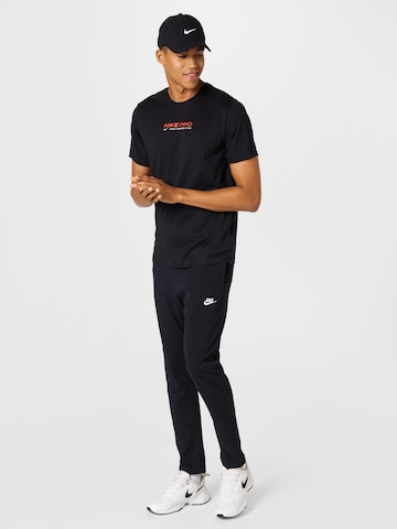 NIKE - Camiseta funcional en negro