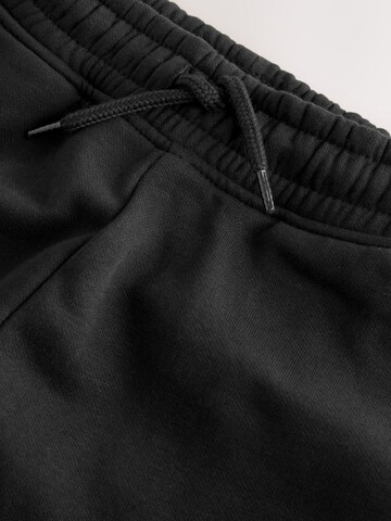 juoda Next Siaurėjantis Kelnės