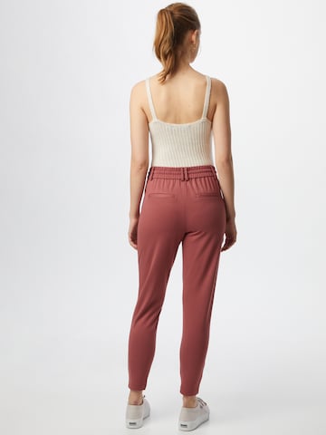 Slimfit Pantaloni con pieghe 'Poptrash' di ONLY in rosso