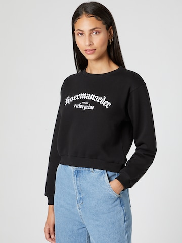 Hoermanseder x About You Sweatshirt 'Ela' in Black: front