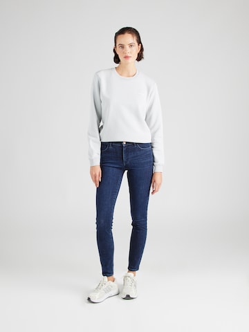 WRANGLER Skinny Džíny 'SKINNY' – modrá