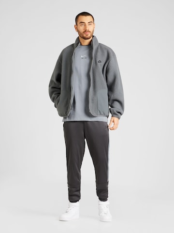 Effilé Pantalon 'AIR' Nike Sportswear en gris