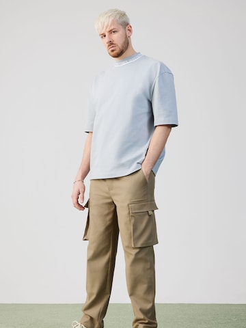 ABOUT YOU x Rewinside Tapered Cargo trousers 'Jakob' in Green