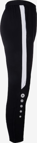 Effilé Pantalon de sport JAKO en noir