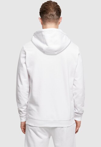 Sweat-shirt 'Merry Christmasy' Merchcode en blanc