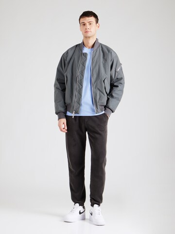 Maglietta di Champion Authentic Athletic Apparel in blu
