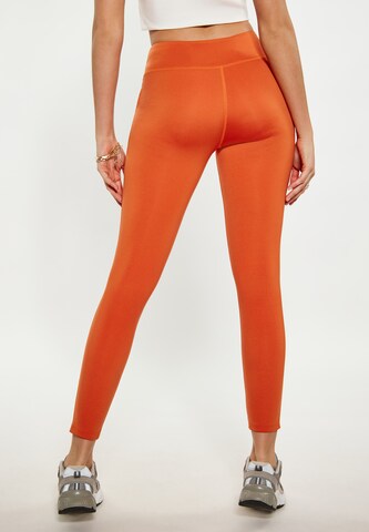 Skinny Pantalon de sport faina Athlsr en orange